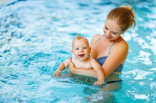 baby and mother in the pool